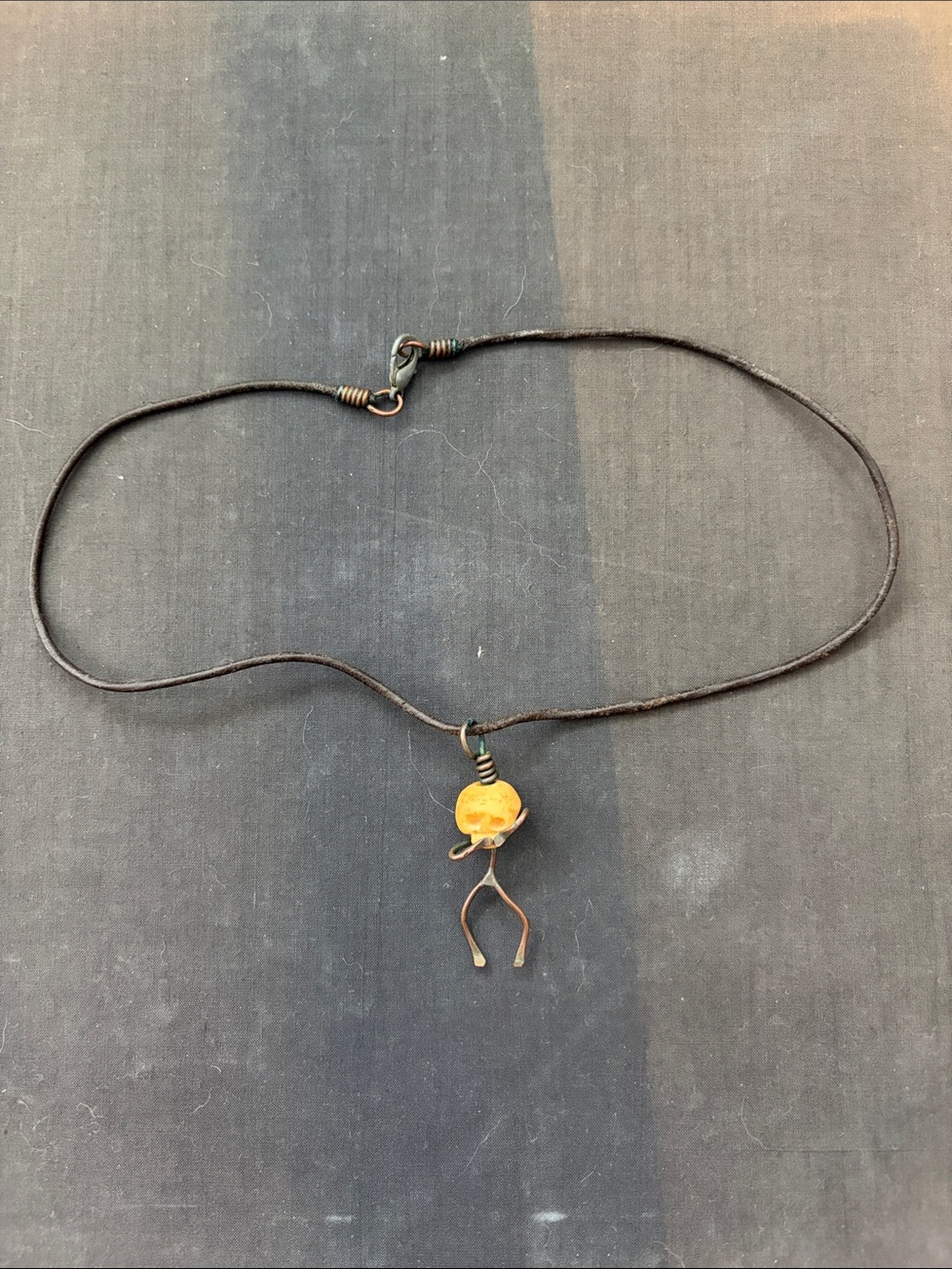 Handcrafted ‘speak no evil’ bone and copper necklace